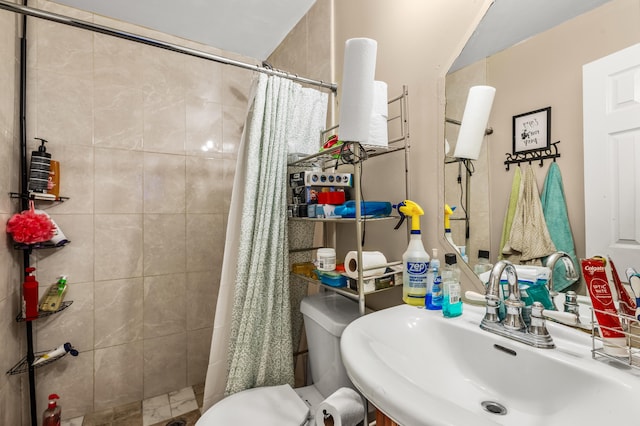 bathroom featuring sink, toilet, and walk in shower