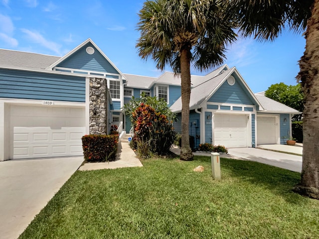 view of front of home featuring a garage and a front lawn