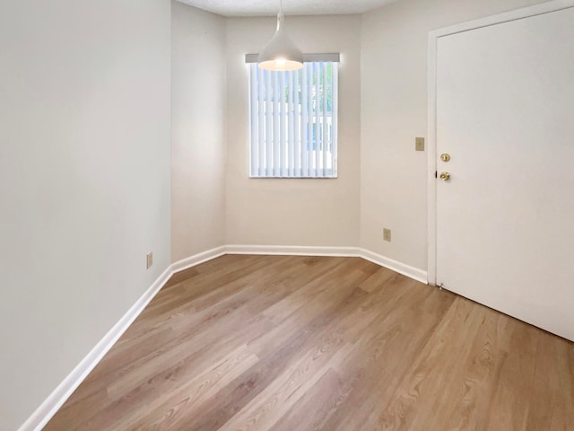 unfurnished room featuring light hardwood / wood-style flooring