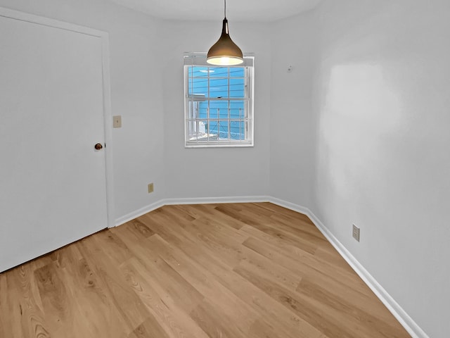 unfurnished dining area featuring hardwood / wood-style floors