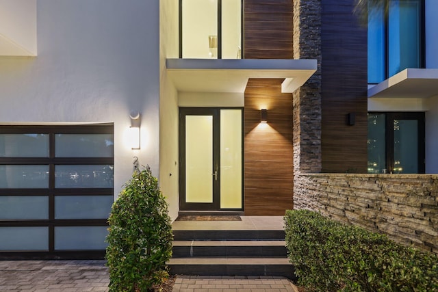 view of exterior entry featuring french doors