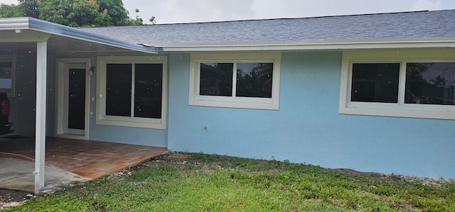 view of side of home featuring a patio