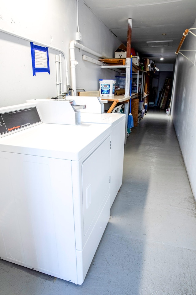 clothes washing area featuring washer and dryer