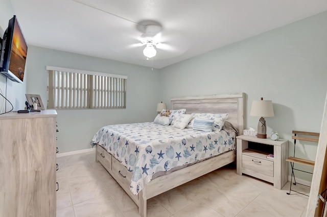 bedroom featuring ceiling fan and light tile patterned floors