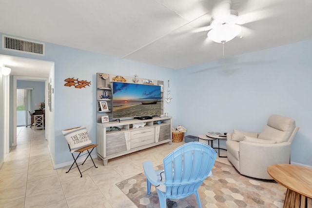 living room with light tile patterned flooring and ceiling fan