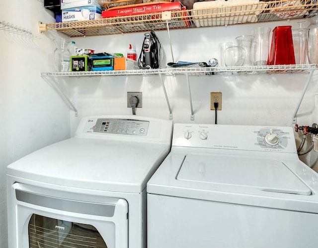 clothes washing area featuring washing machine and dryer