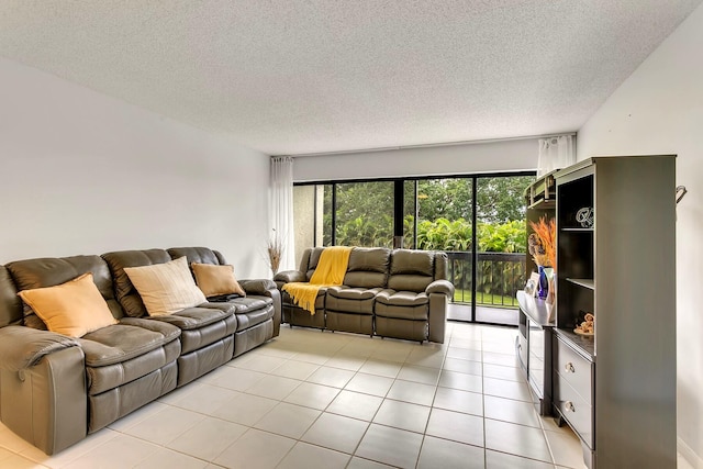 living room featuring a textured ceiling and light tile patterned flooring