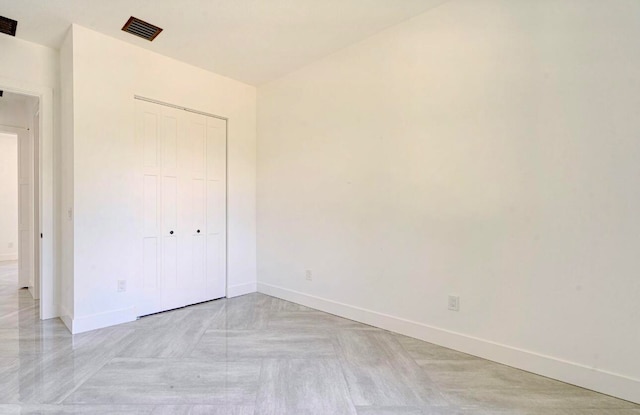 unfurnished bedroom with a closet