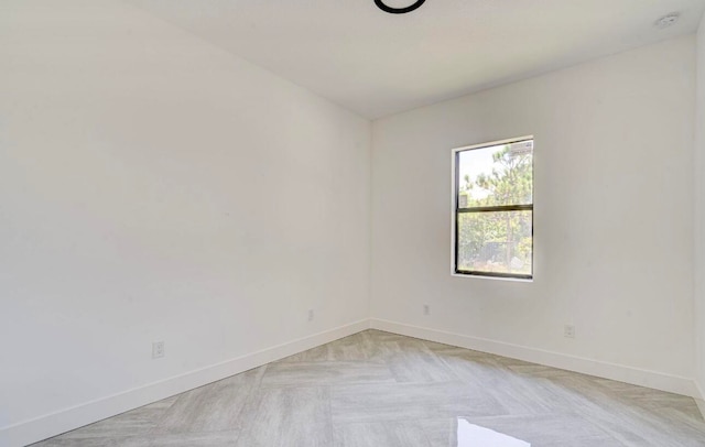 spare room featuring light parquet flooring