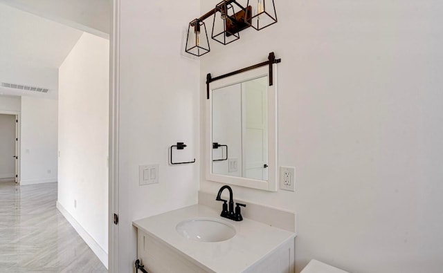 bathroom featuring tile patterned flooring and vanity