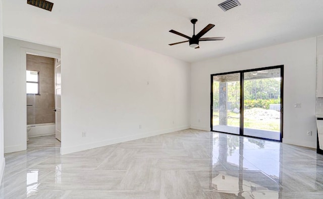 unfurnished room featuring ceiling fan, light tile patterned floors, and a healthy amount of sunlight