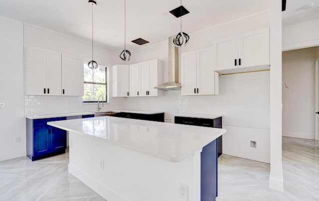 kitchen with white cabinetry, a center island, and pendant lighting