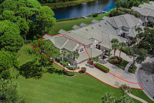 view of property featuring a garage and a front yard