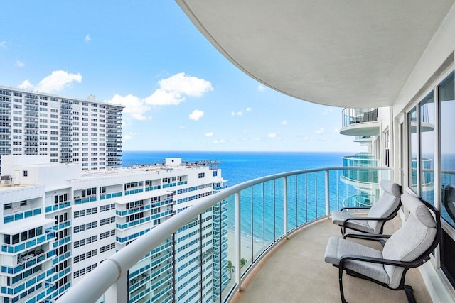 balcony featuring a water view