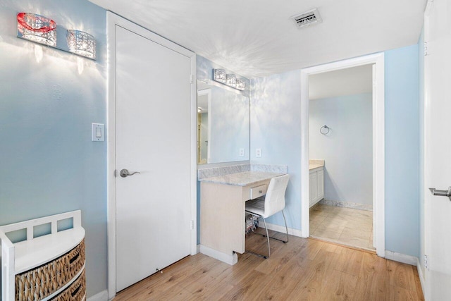 bathroom with hardwood / wood-style flooring and vanity