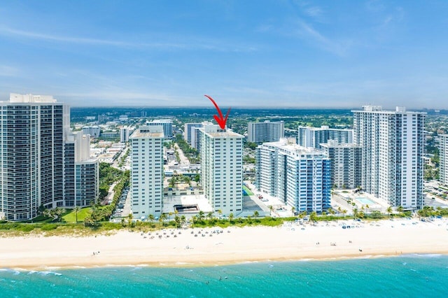 bird's eye view with a view of the beach and a water view