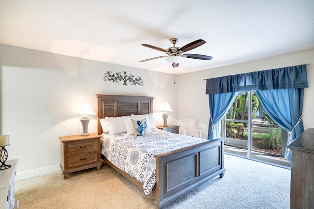 carpeted bedroom with ceiling fan and access to exterior