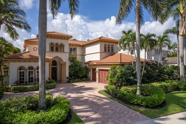 mediterranean / spanish-style house featuring a garage