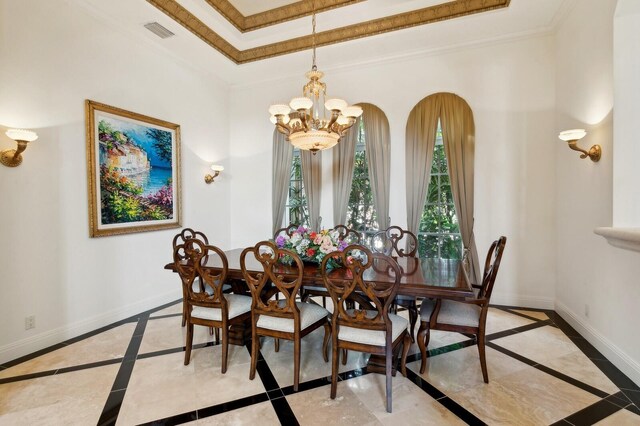 living room with a tray ceiling, crown molding, ceiling fan, and light tile patterned flooring