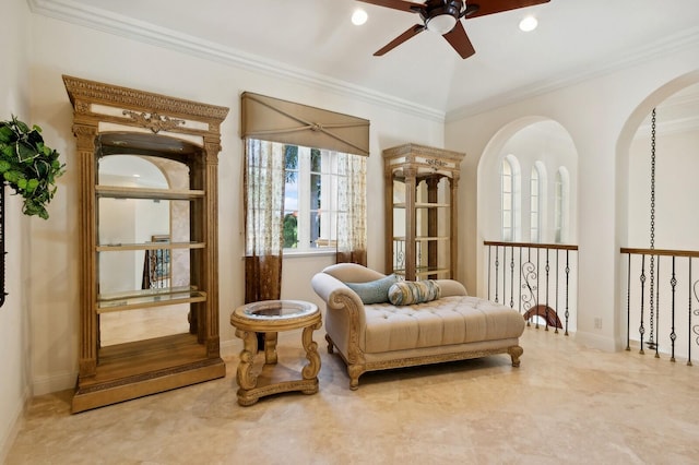 sitting room with crown molding and ceiling fan