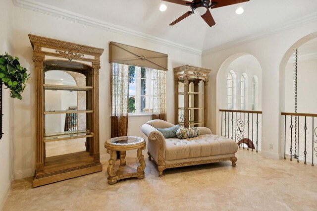 carpeted bedroom with ceiling fan and ornamental molding