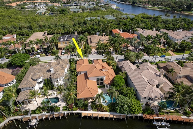 birds eye view of property with a water view