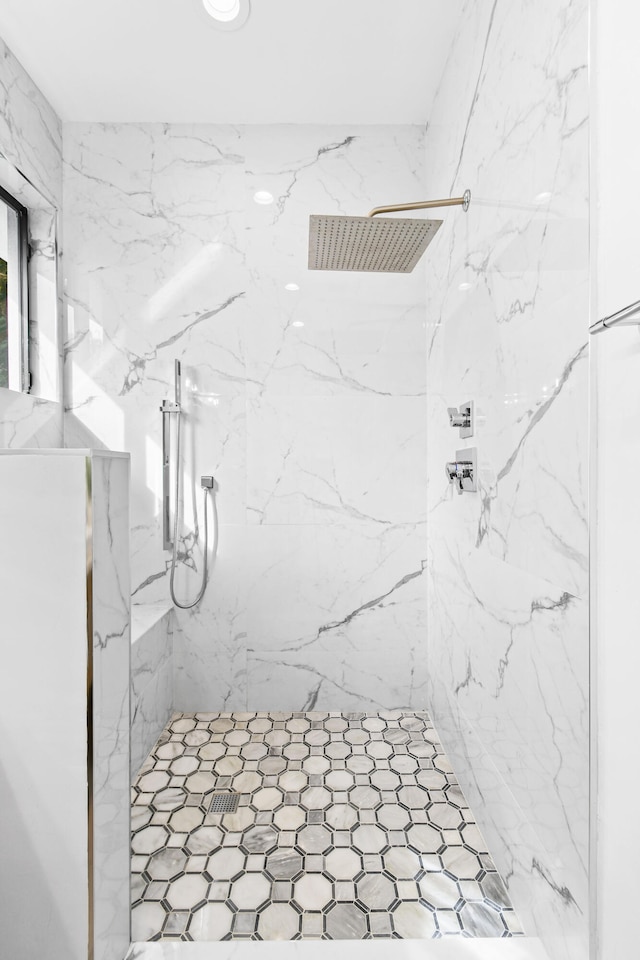 bathroom featuring tiled shower