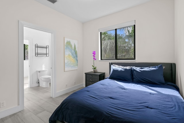 bedroom featuring ensuite bath