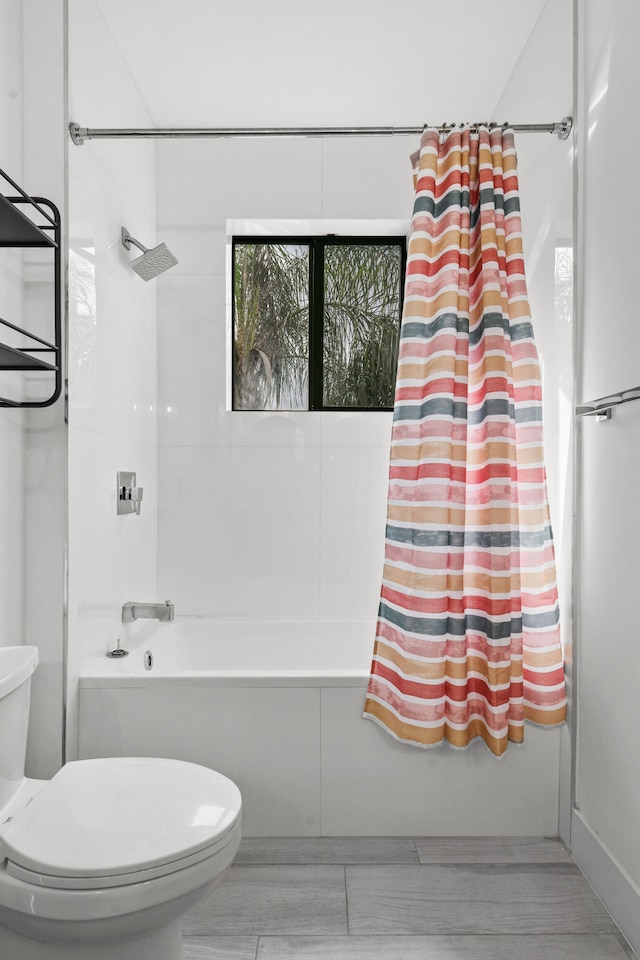 bathroom with toilet and shower / bathtub combination with curtain