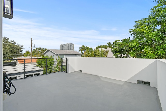 view of patio featuring a balcony