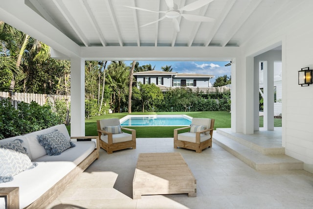 view of patio featuring ceiling fan, outdoor lounge area, and a fenced in pool