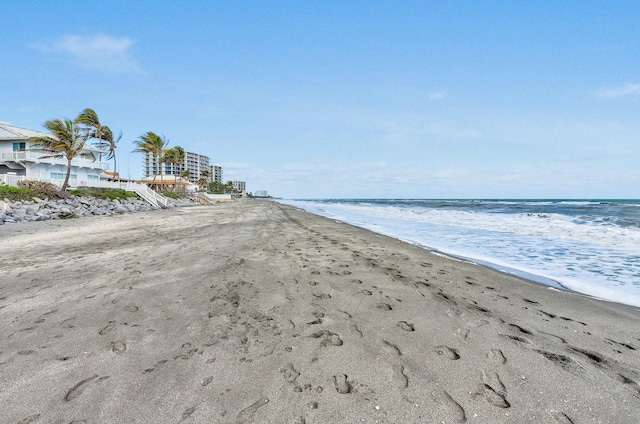 property view of water featuring a beach view