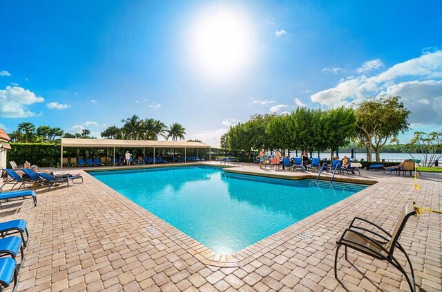 view of pool featuring a patio