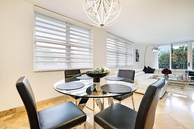 tiled dining area with an inviting chandelier