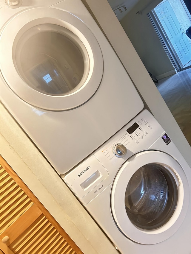 washroom with stacked washer and dryer