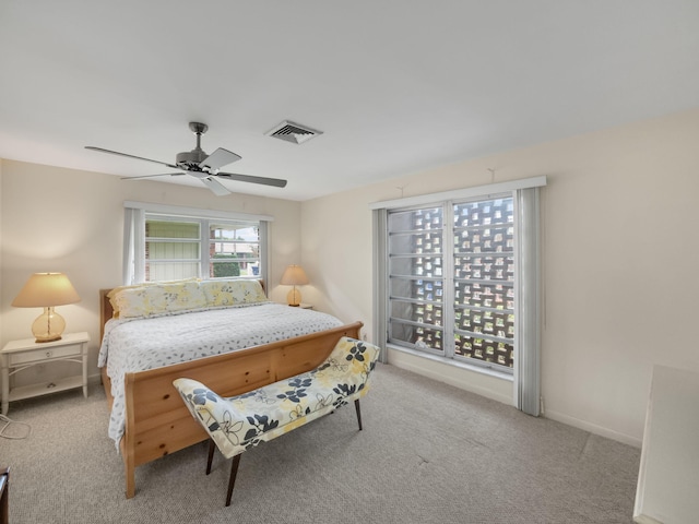 bedroom featuring ceiling fan and light colored carpet