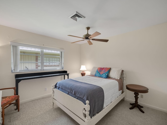 bedroom with light carpet and ceiling fan