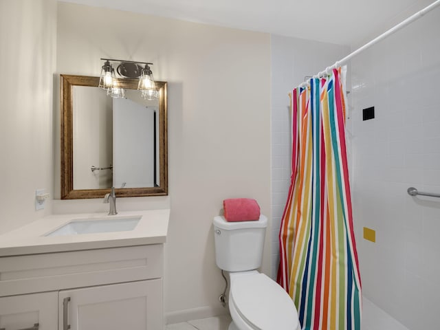 bathroom featuring vanity, toilet, and walk in shower