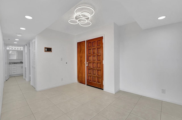 foyer entrance with light tile patterned flooring