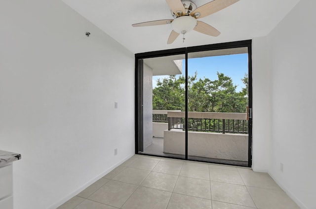 tiled empty room with a healthy amount of sunlight and ceiling fan