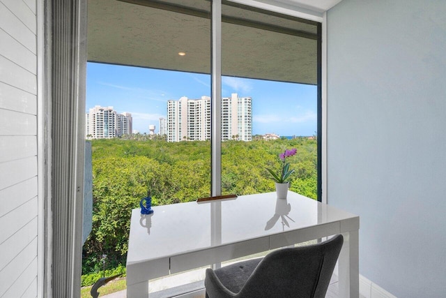 office space with a wealth of natural light and a city view