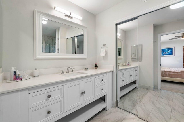 bathroom with ceiling fan, tile patterned flooring, and vanity