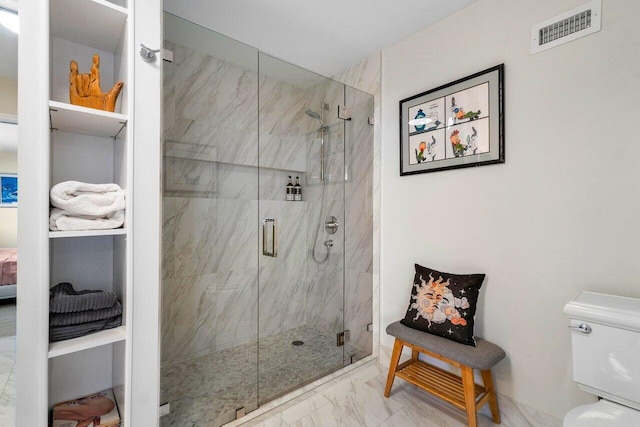 full bathroom with a marble finish shower, marble finish floor, visible vents, and toilet