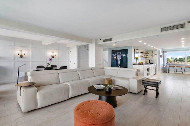 living room with light hardwood / wood-style flooring