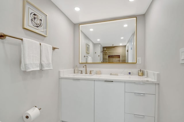 bathroom with vanity and walk in shower