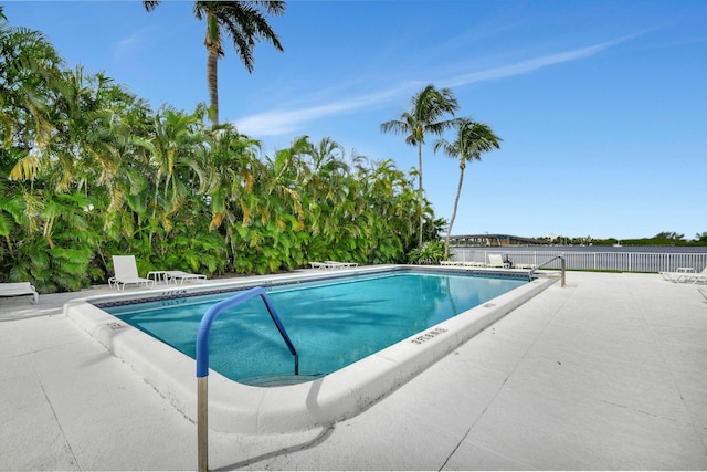 view of swimming pool with a patio