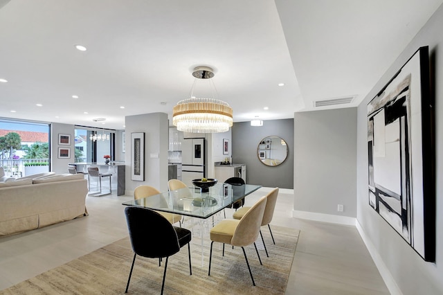 dining room with a notable chandelier