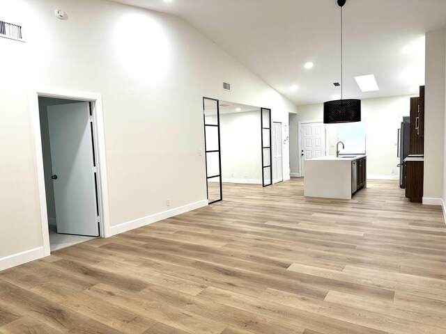 spare room featuring ceiling fan and light hardwood / wood-style flooring