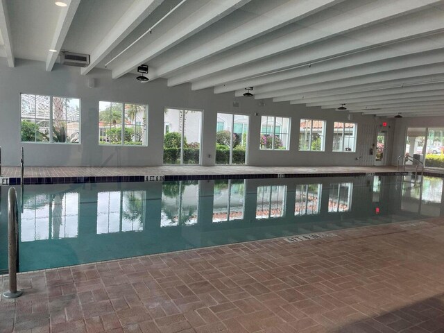 exercise room featuring dark colored carpet