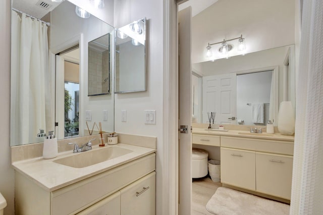 bathroom with toilet and vanity